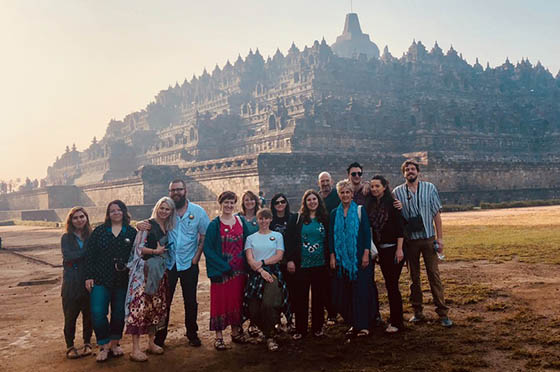 Photo of a group of Chatham University students posing in front of a building in Indonesia