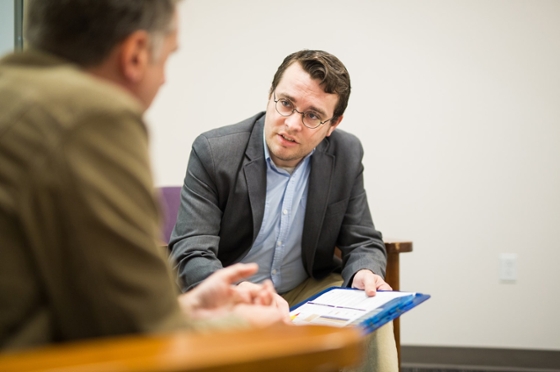 Photo of a Chatham University psychology student speaking with a patient at a counseling session. 