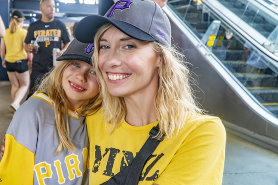 Photo of a Chatham University employee and a child at a Pirates game