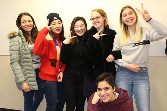 Photo of a group of Chatham University international students posing together with smiles