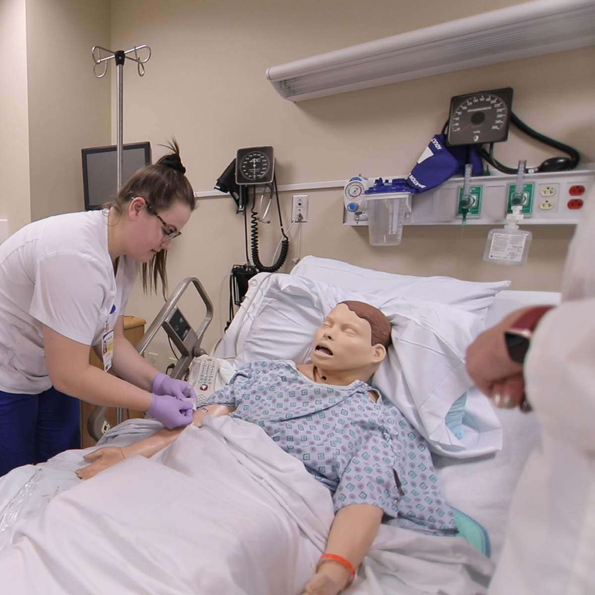 Chatham Pathways to Nursing students practice on a dummy patient