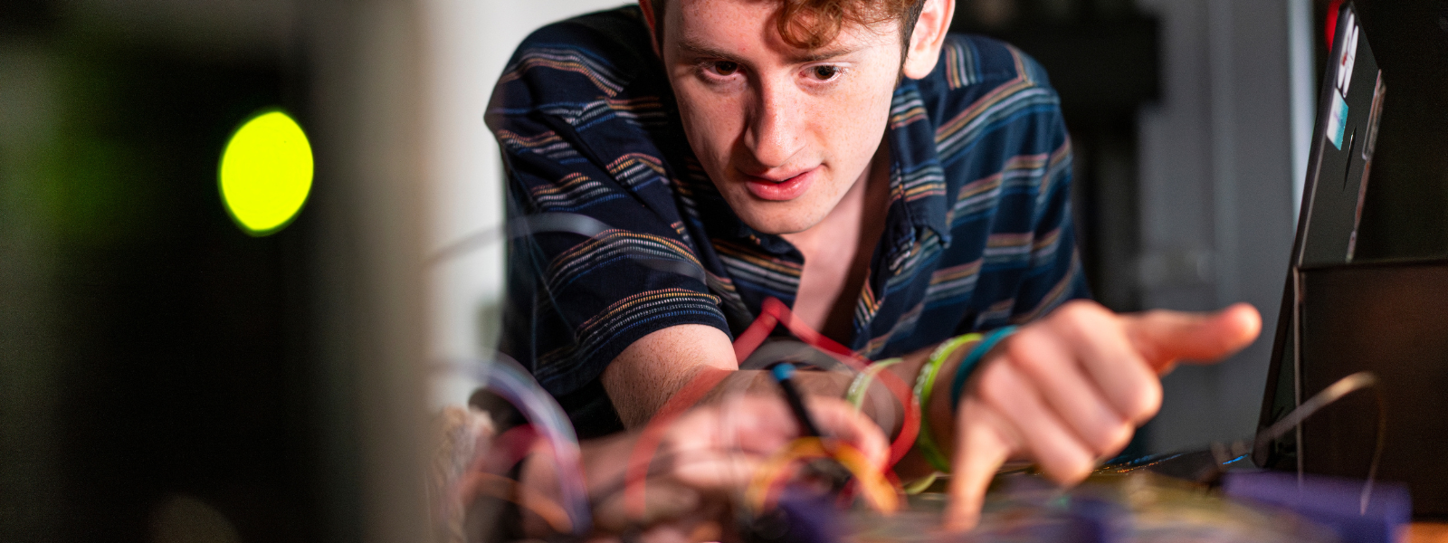 Chatham University Immersive Media student working in a lab