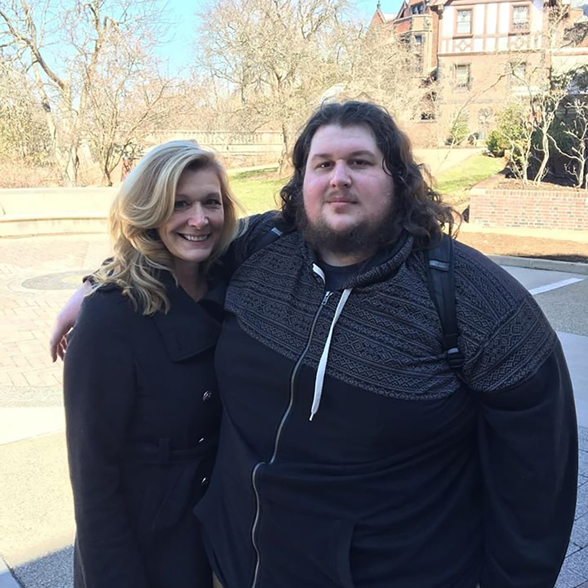 Photo of Christopher posing with a woman on Shadyside Campus