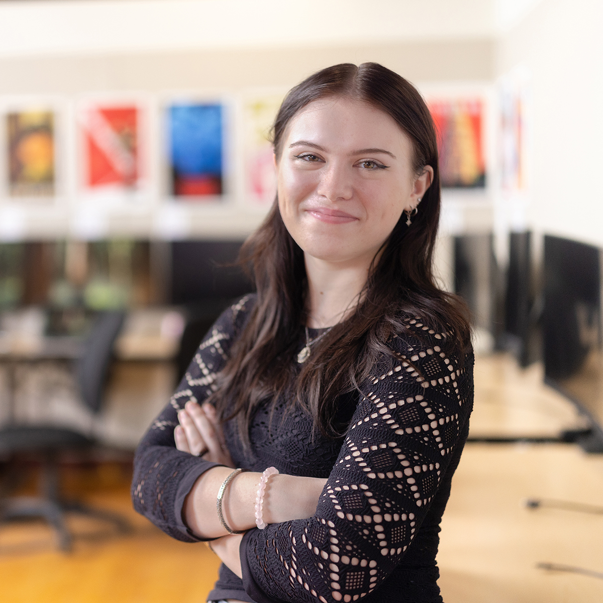 Chatham Marketing student poses for a photo in a Pittsburgh classroom