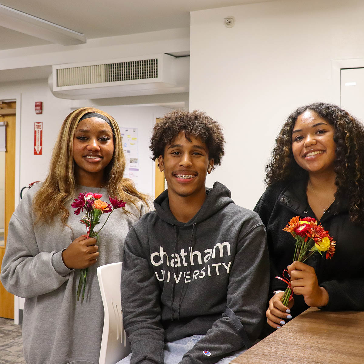 BIPOC Chatham students at a BIPOC Family Dinner with flowers