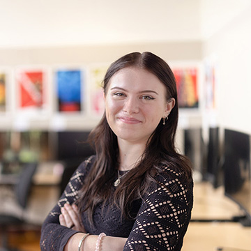 Chatham Marketing student poses for a photo in a Pittsburgh classroom