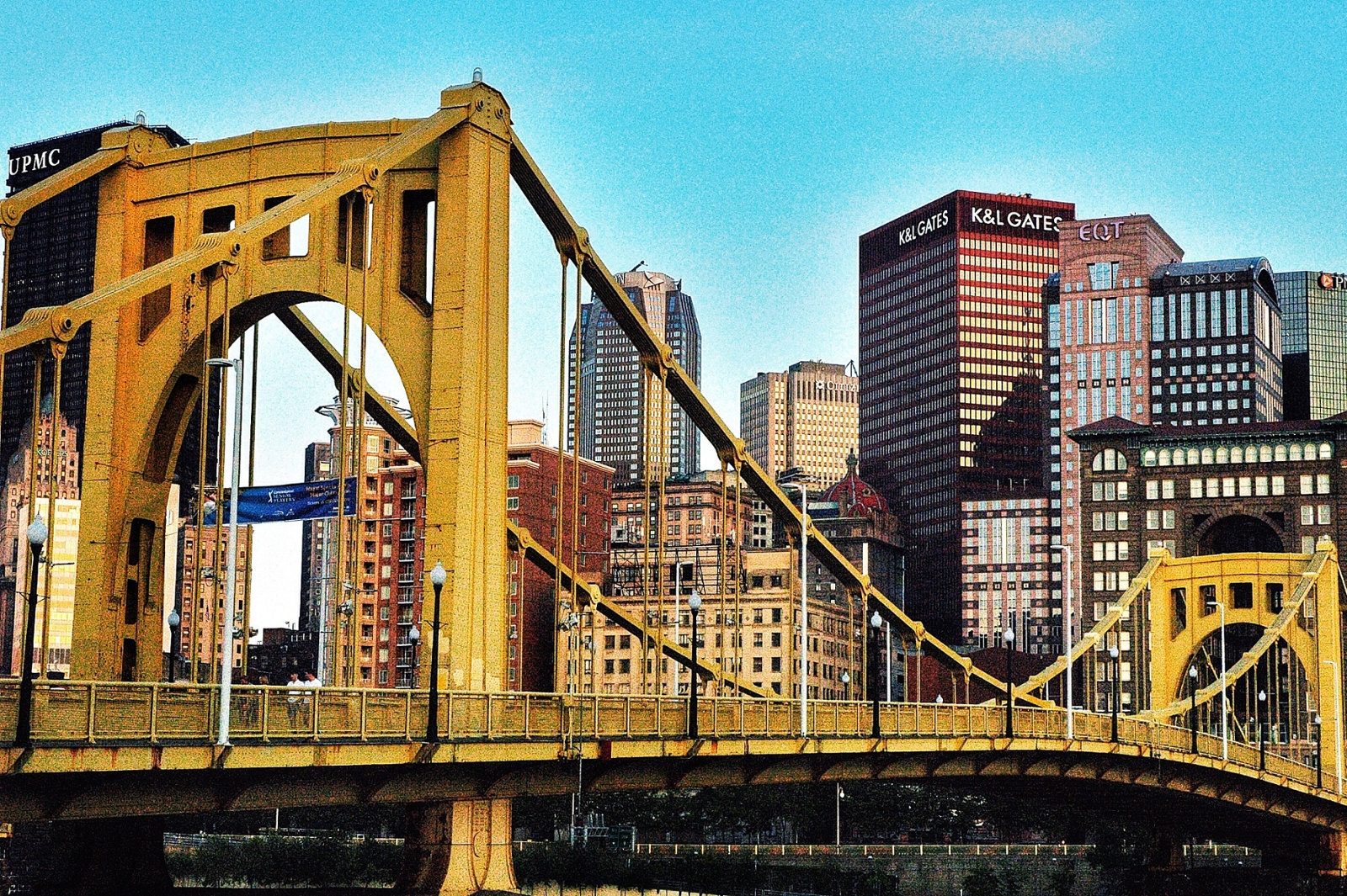 Photo of Pittsburgh's skyline with a yellow bridge