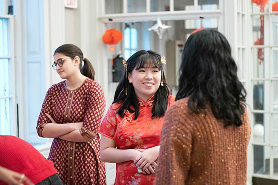 Photo of BIPOC students with food at a table