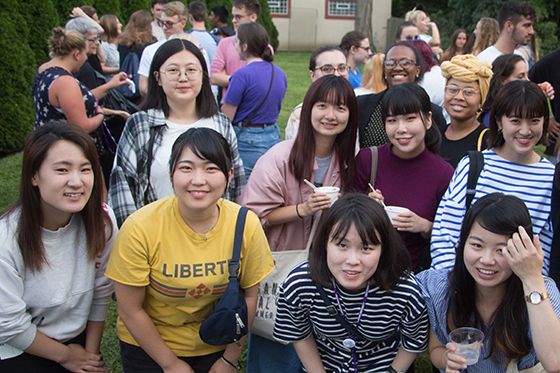 Photo of a group of international Chatham University students posing together at a multicultural affairs event.